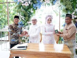 Pj Bupati Kampar Jadi Saksi Akad Nikah Putri H. Alamsyah Dengan Putra H. Afrizal